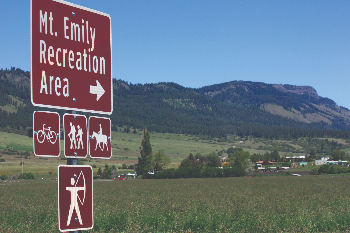 sign for Mt. Emily Recreation Area with scenic view of mountains in background