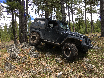 Jeep on rugged mountain trail
