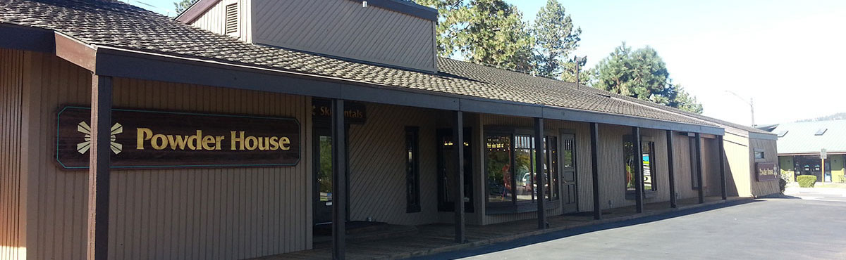 Powder House building with a sign and awning.