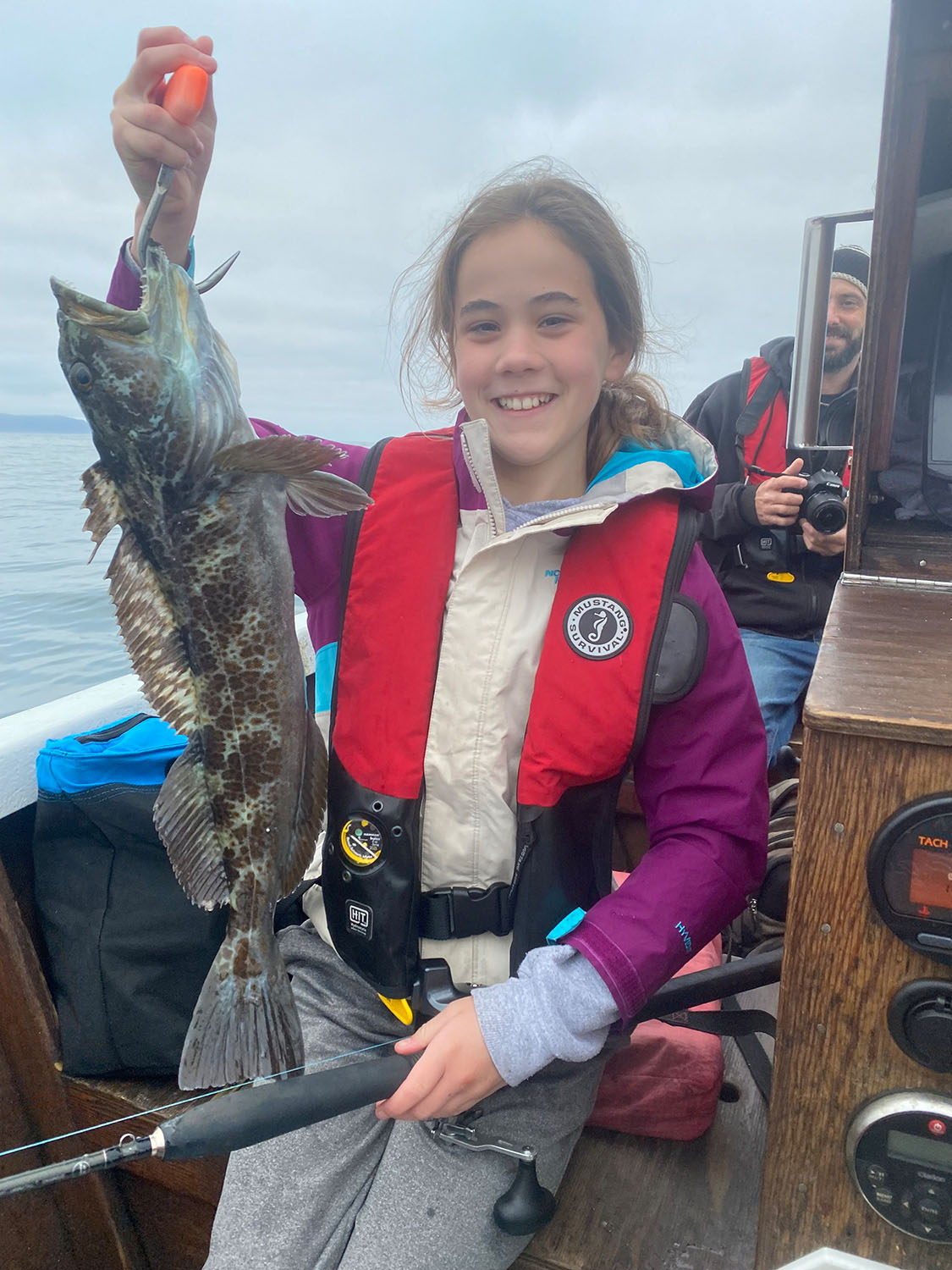Girl shows off catch with Haystack Fishing