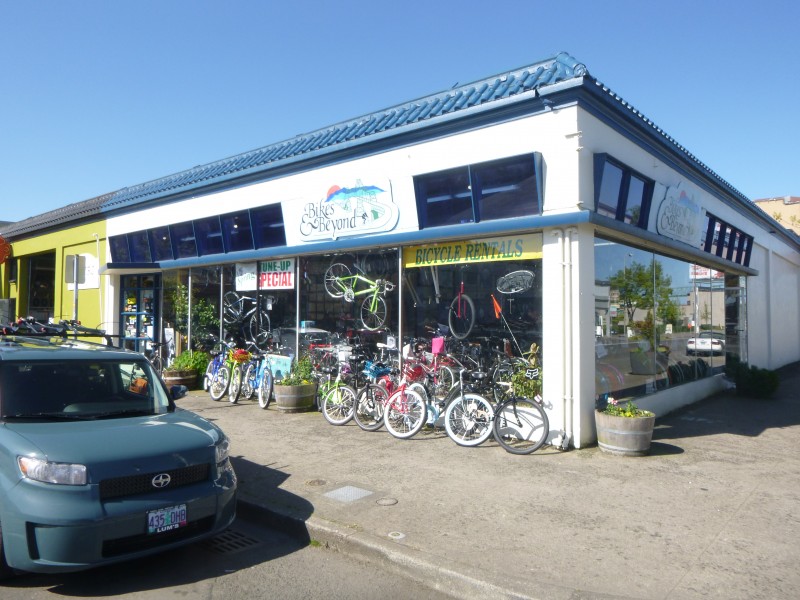 exterior of one story bike shop with bikes on display on the sidewalk