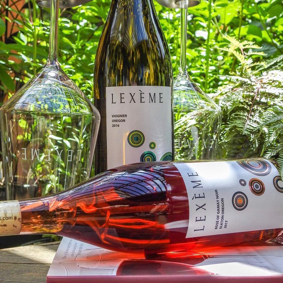two bottles of Lexeme wine with upside down wine glass