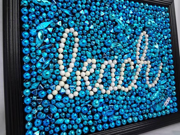 framed beaded artwork with the word beach spelled out