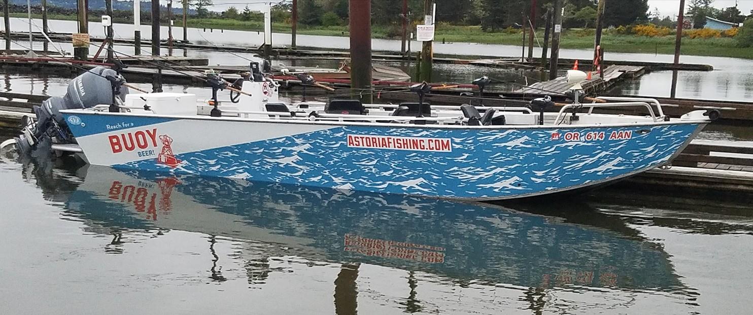 motorized boat with Buoy beer logo painted on side