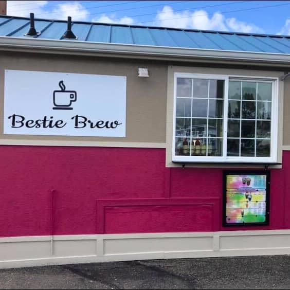 exterior of drive through coffee cart with sign for Bestie Brew posted