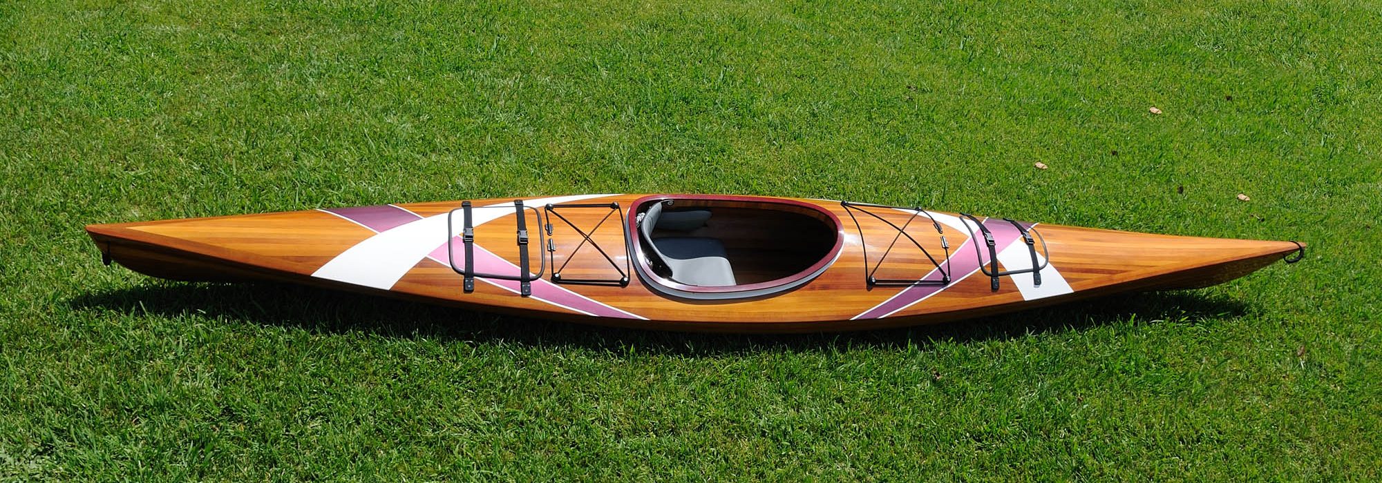 Salmon River wooden kayak resting in the grass Otis Oregon