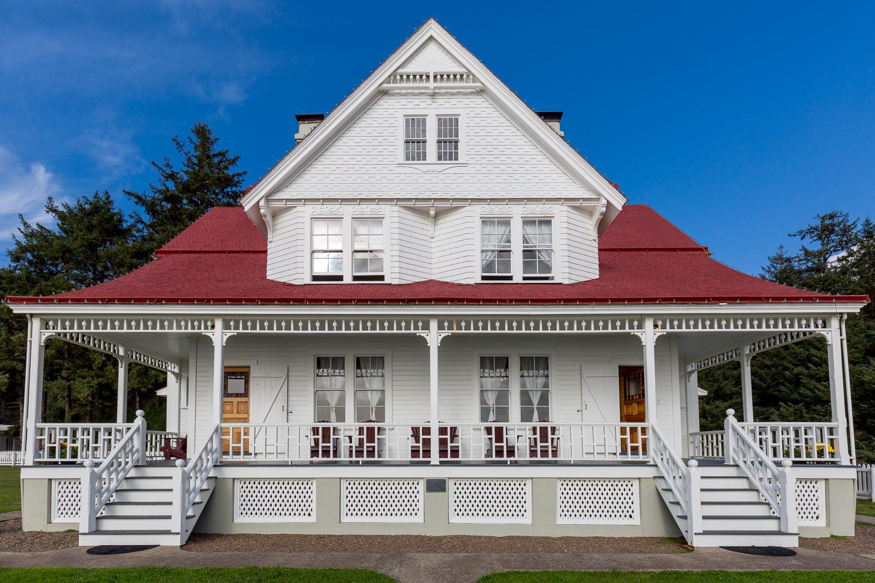 exterior image of two story bed & breakfast with wrap around porch