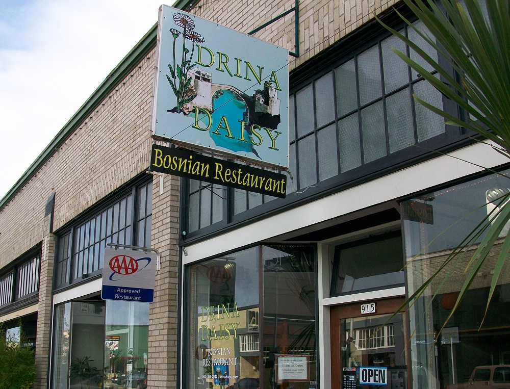 sign and storefront of Drina Daisy bosnian restaurant