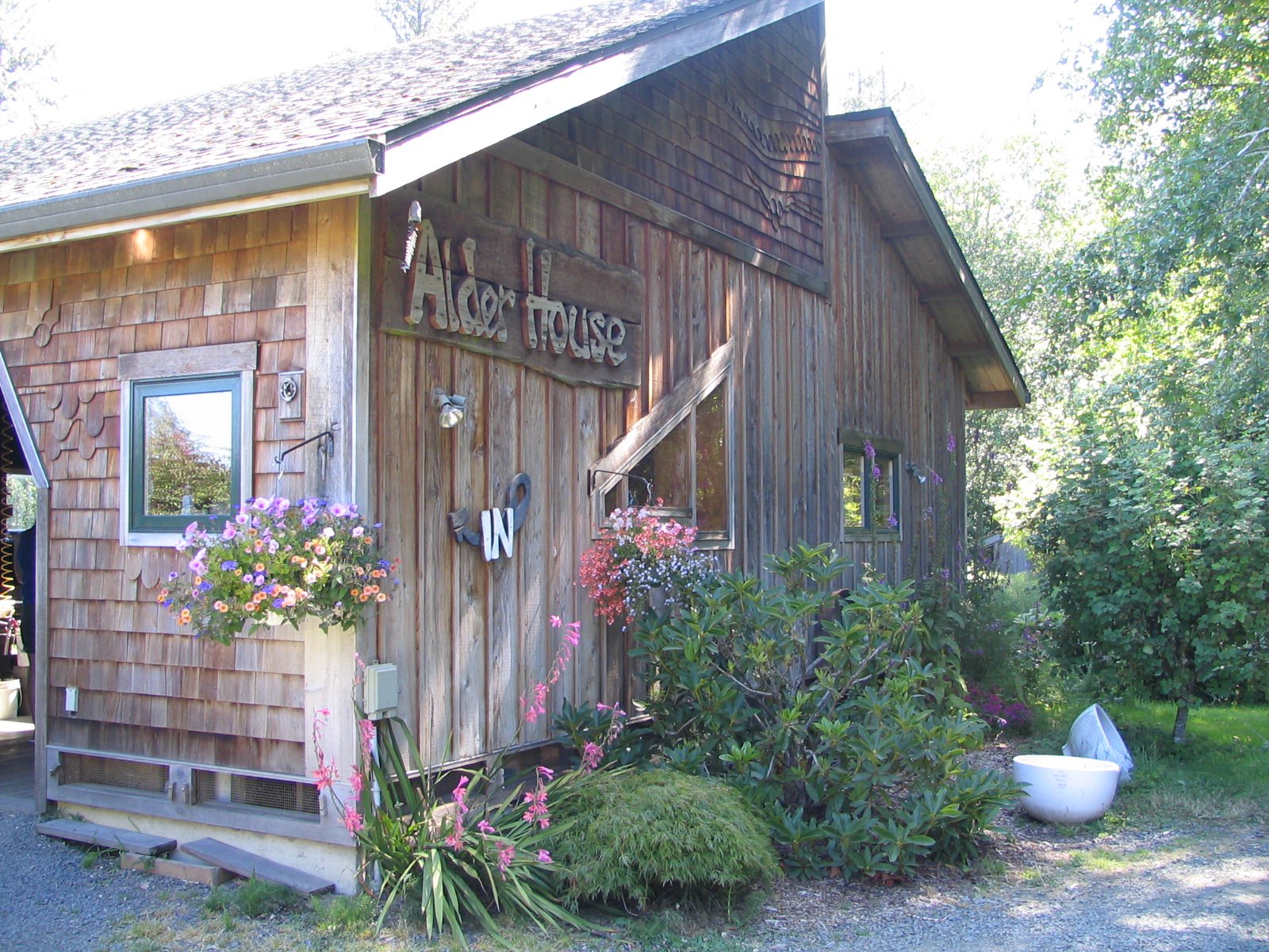 exterior of cottage style building with lettering for Alder House near the entrance