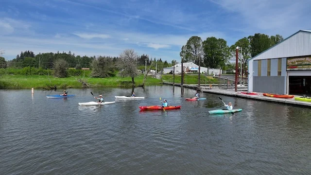 Paddlers leaving the docks to explore Scappoose Bay