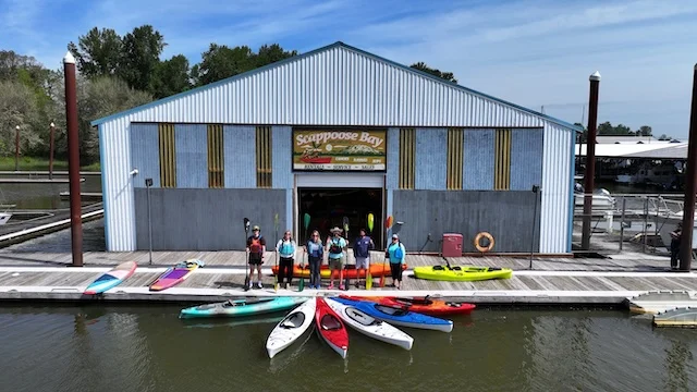 Happy paddlers renting kayaks