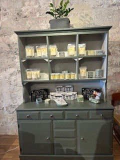 Hutch of handcrafted candles and soaps
