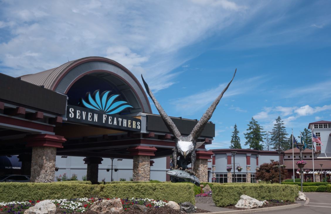 exterior of casino resort with eagle sculpture in foreground