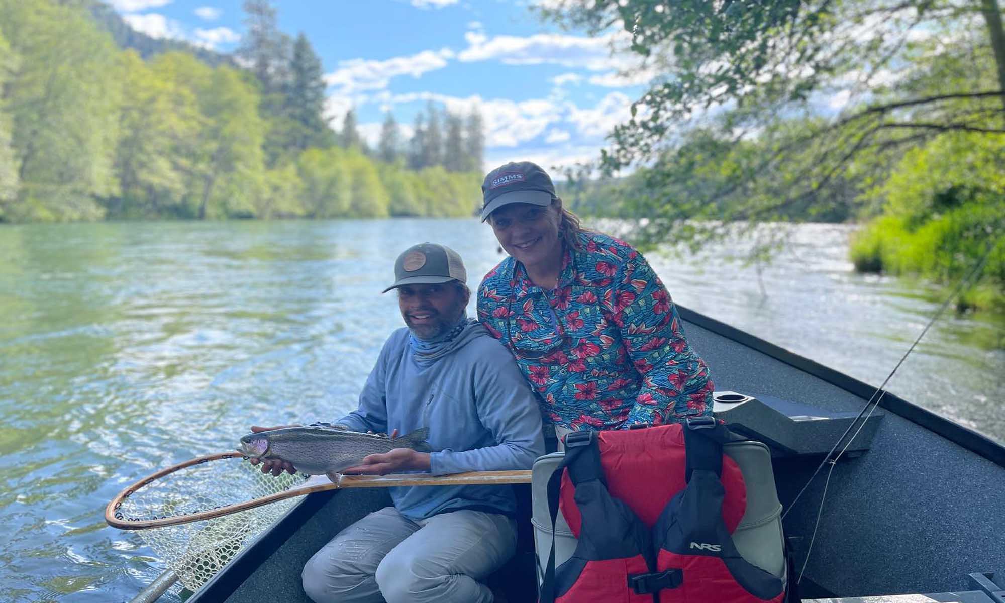 Successful fisher couple showing off their catch