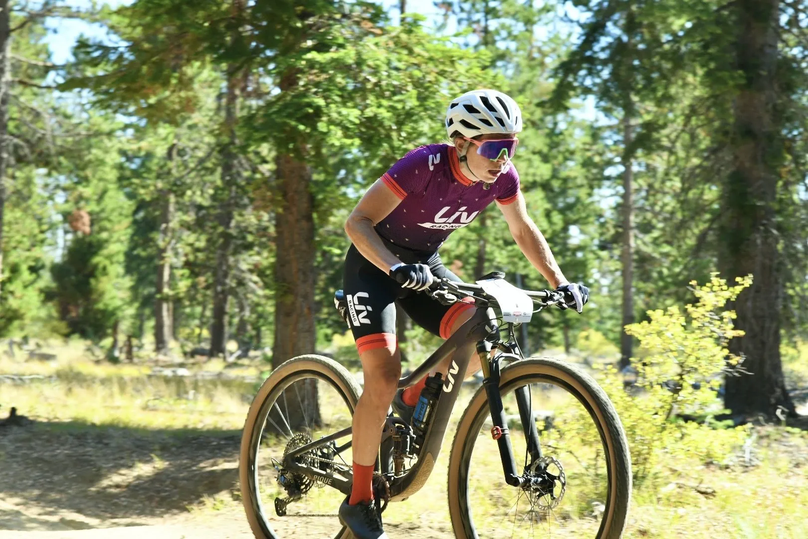 A cyclist pedals through a forest trail outside Bend.