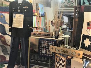 Photo of military uniform in shop window display