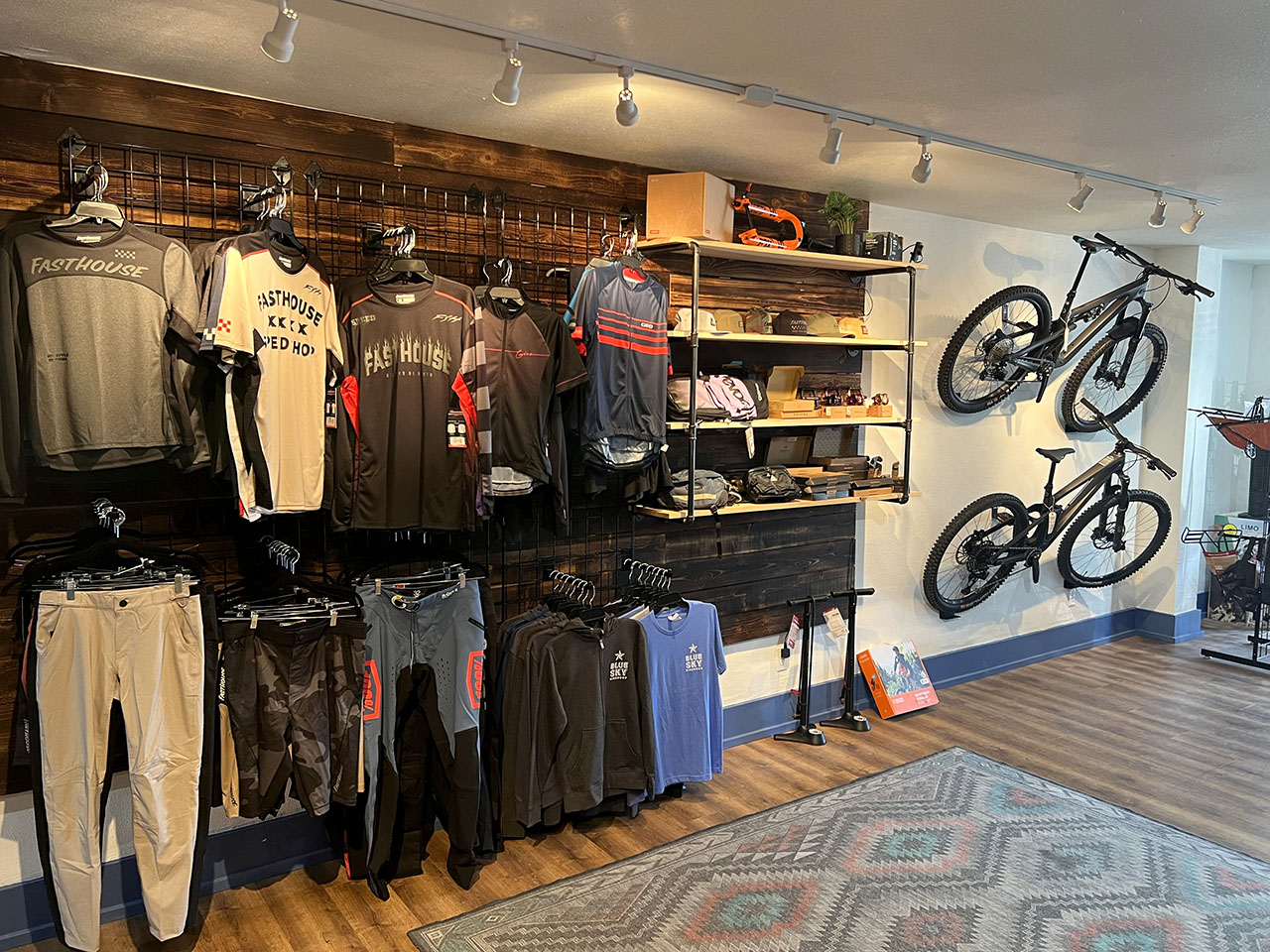 Interior of store with clothes for sale at Blue Sky Bike Shop in Coos Bay, Oregon