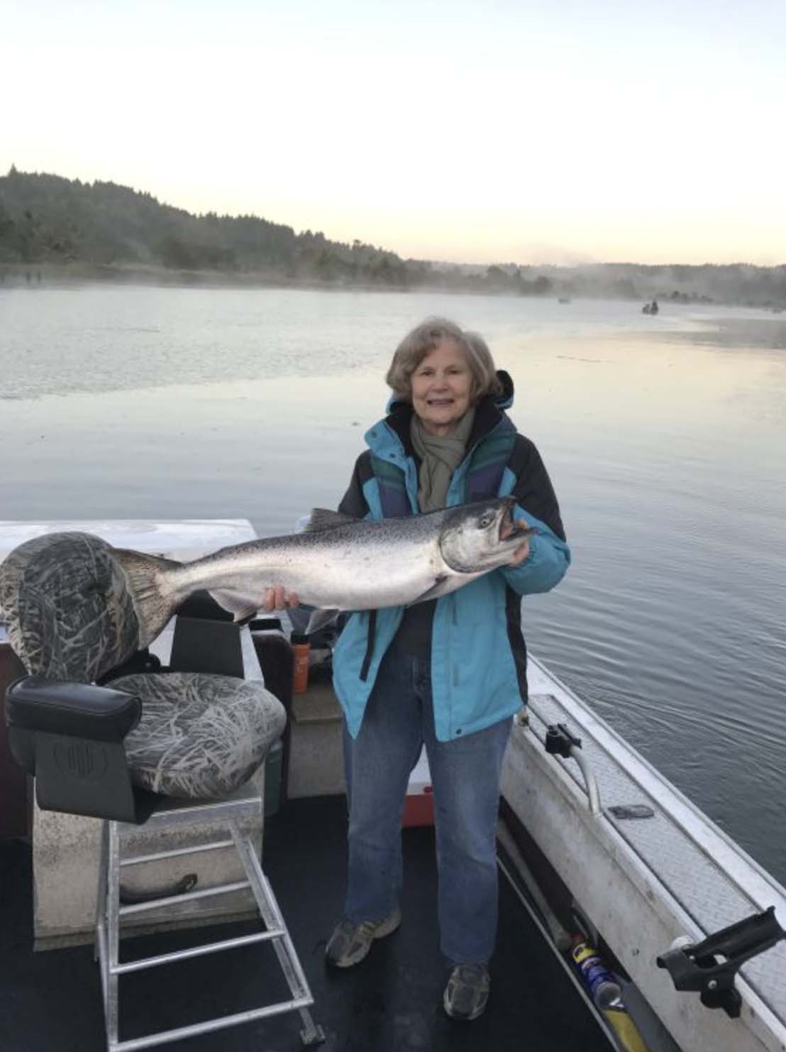 Woman holding a fish she caught with Fish Oregon Guide Service in Bandon, Oregon