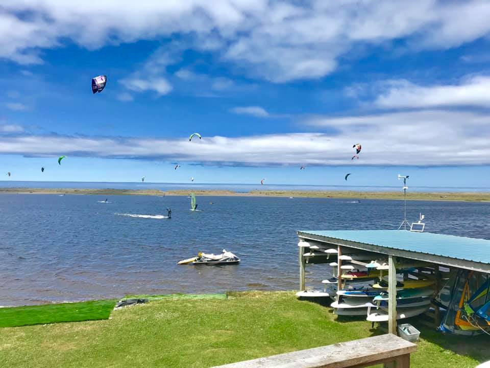 Kiteboarders and windsurfers at Floras Lake in Langlois, Oregon
