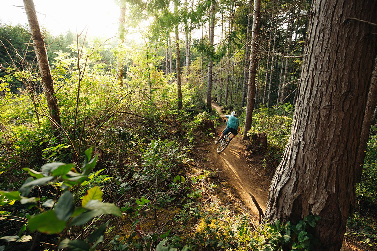 Man riding mountain bike at Whiskey Run Trails in Bandon, Oregon