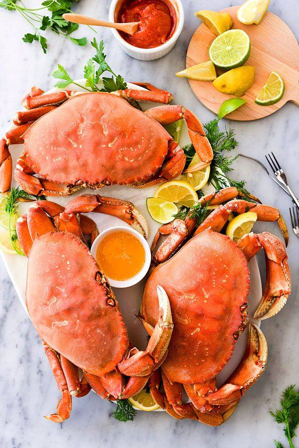 Crab dinner with butter, fresh citrus, and sauce