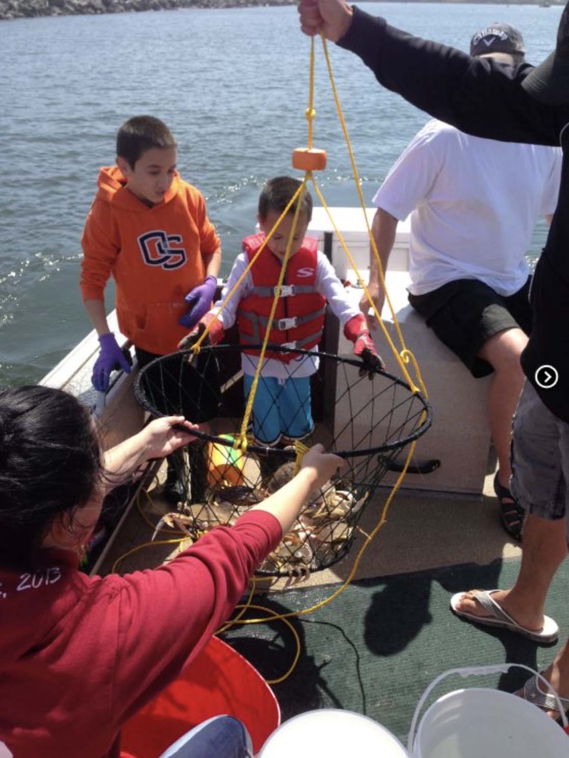 A family crabbing with Fish Oregon Guide Service in Bandon, Oregon