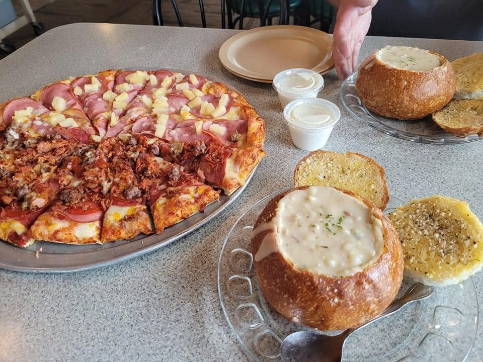 Pizza and clam chowder in a bread bowl at Bedrock's on the Bay in Winchester Bay, Oregon