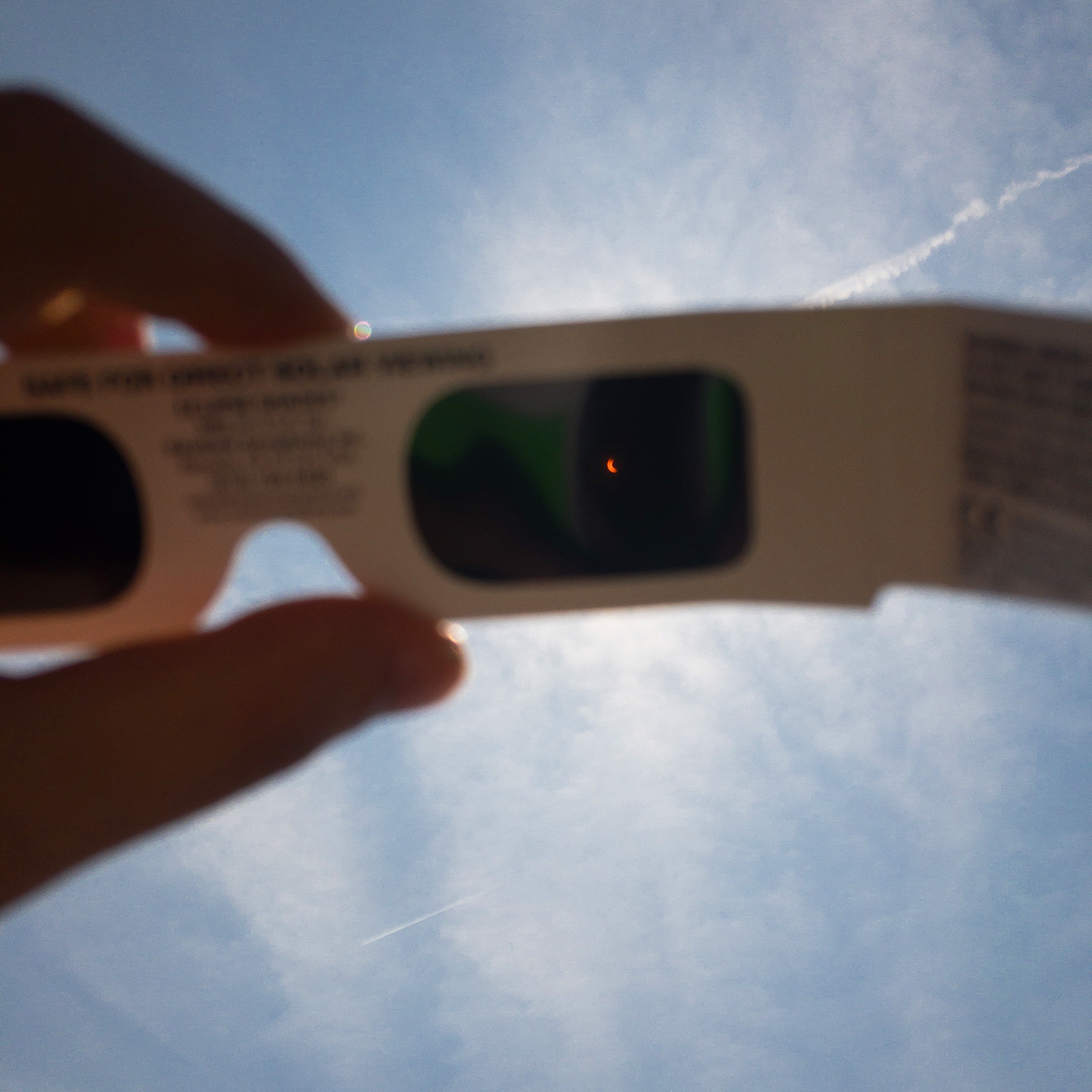 Viewing a solar eclipse through safety glasses