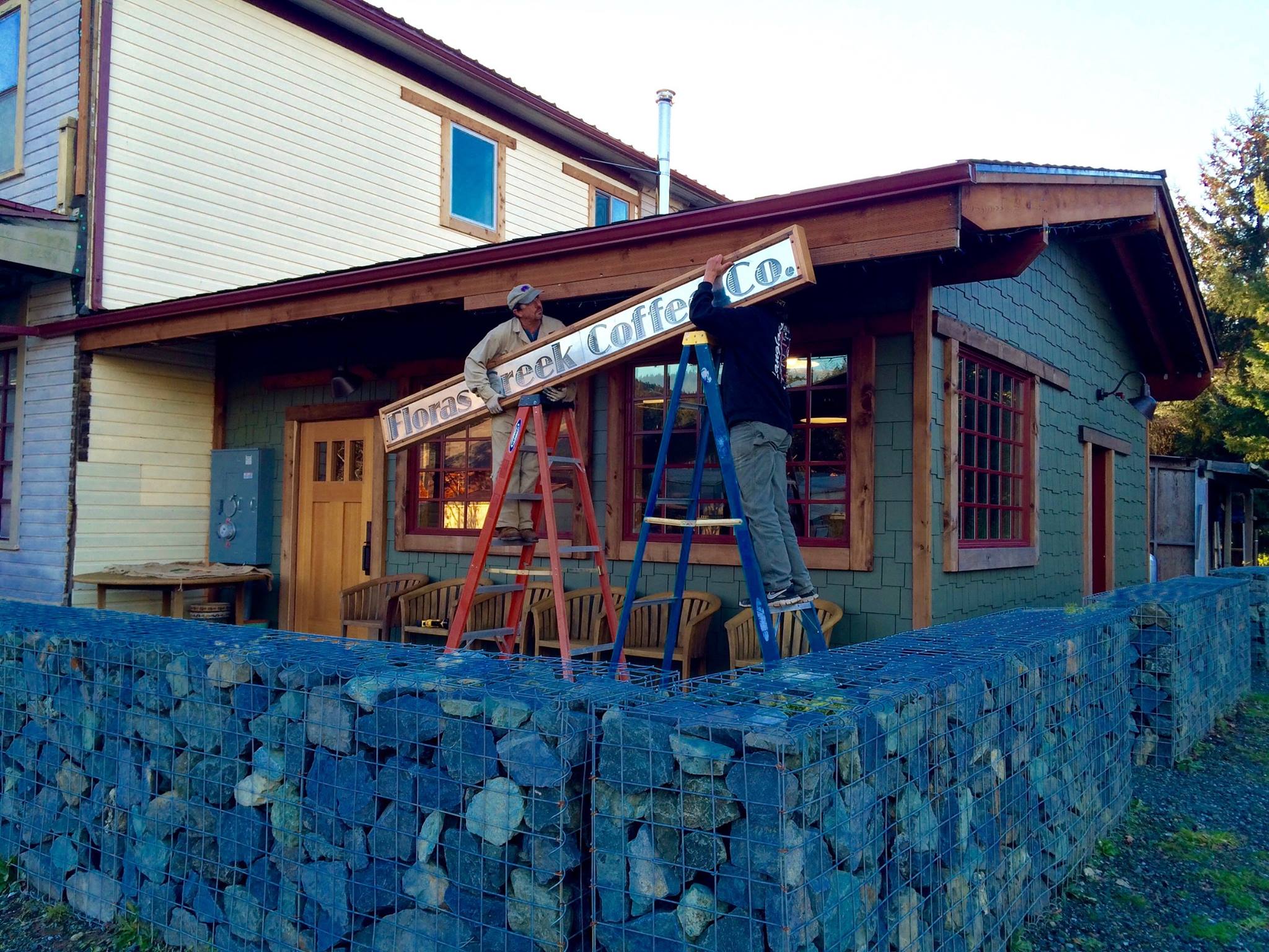New sign being installed at Floras Creek Coffee in Langlois, Oregon