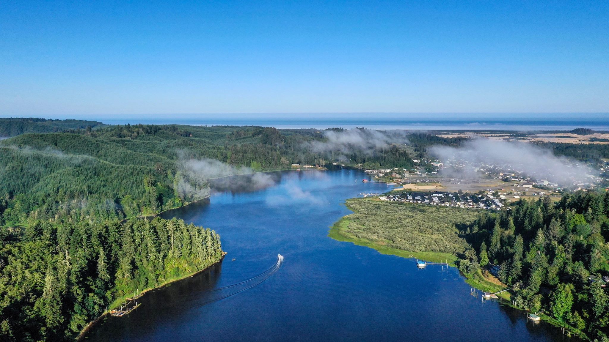 Aerial view of Tenmile Lake, Oregon Dunes, and the ocean.