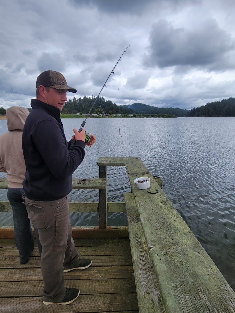 Fishing off of the public docks at Tenmile Lake County Park and Campground in Lakeside, Oregon