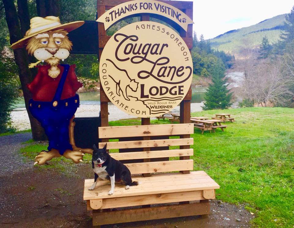 Welcome sign at Cougar Lane Lodge in Agness, Oregon