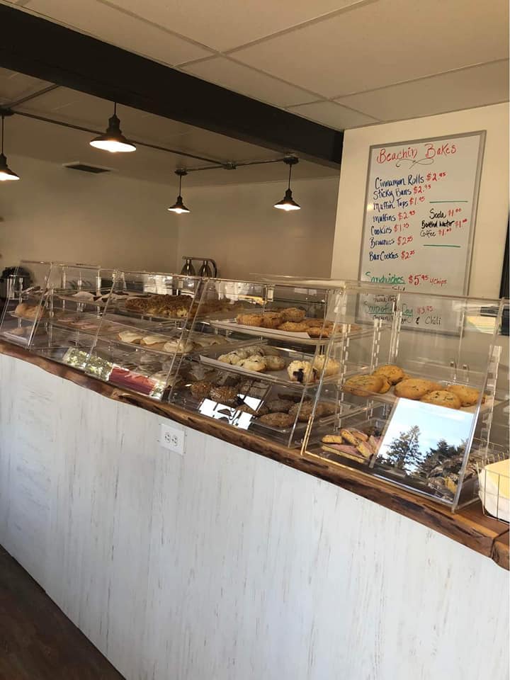 baked goods in display cases on counter of bakery