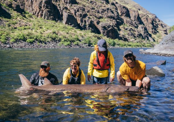 Hells Canyon Adventures guests holding a sturgeon