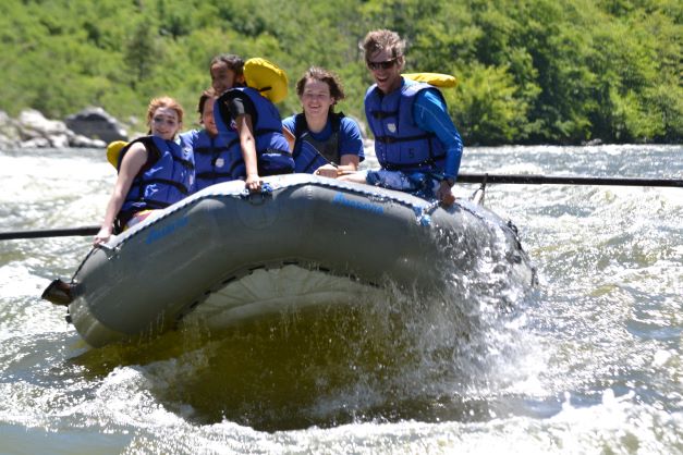 a group of five rafting