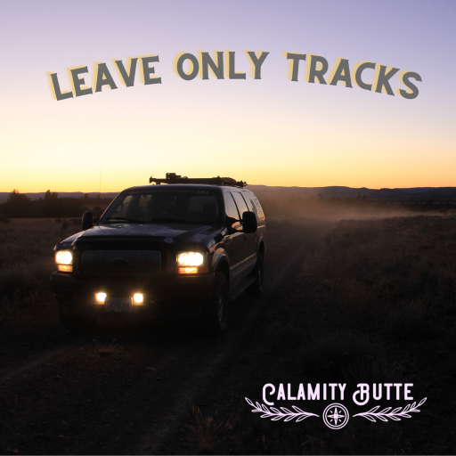 Calamity Butte Guide Service vehicle at sunset, with "leave only tracks" at the top of the image