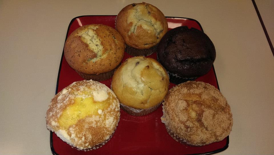 variety of muffins on a red plate