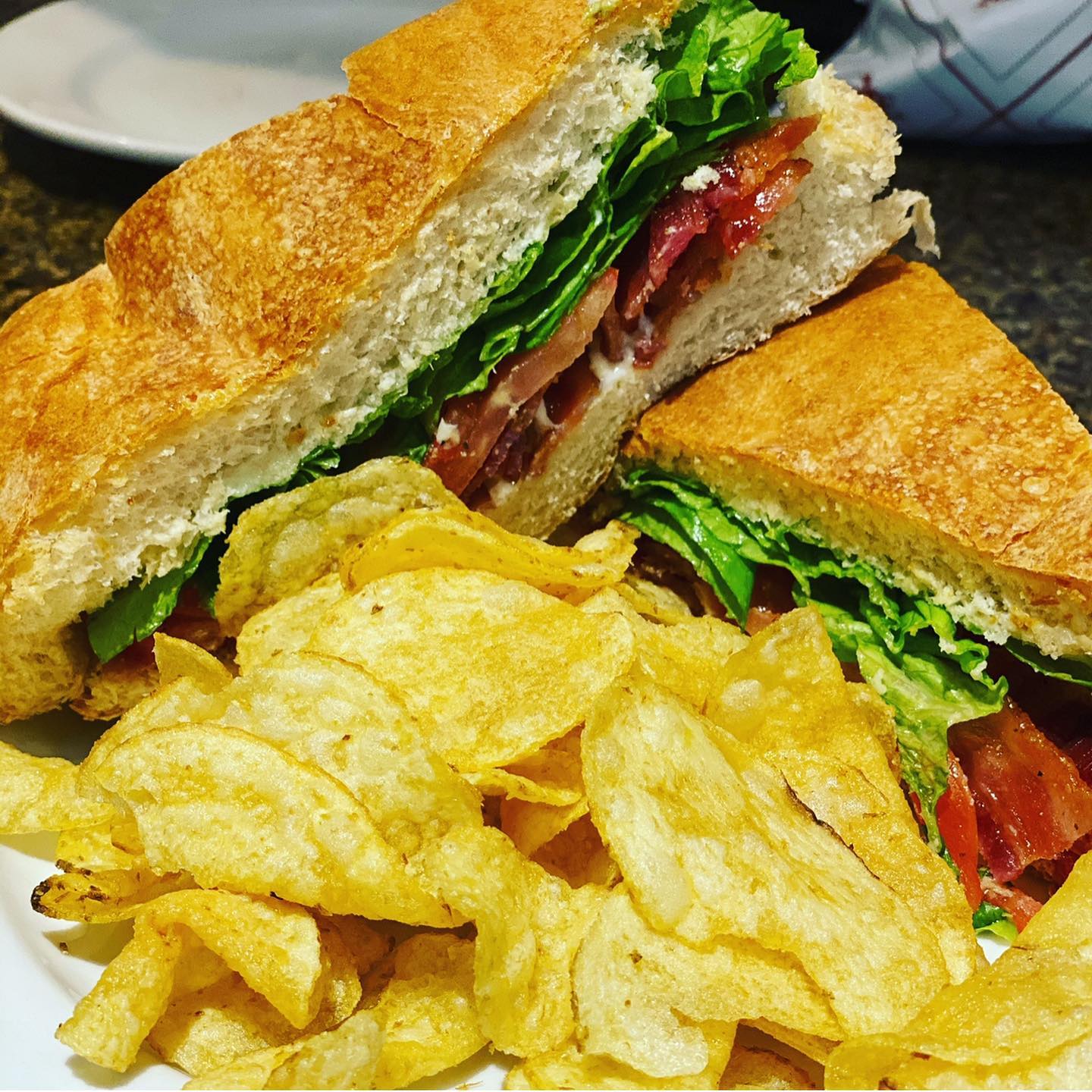 BLT on focaccia bread with potato chips