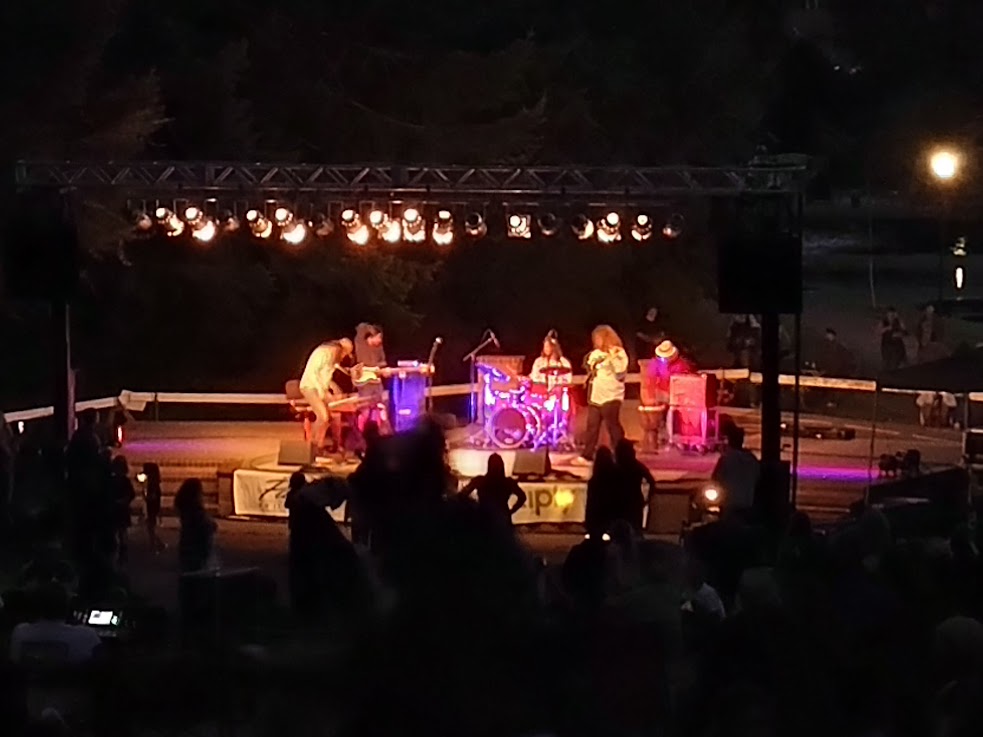 night time photo of a band on stage in Mingus Park