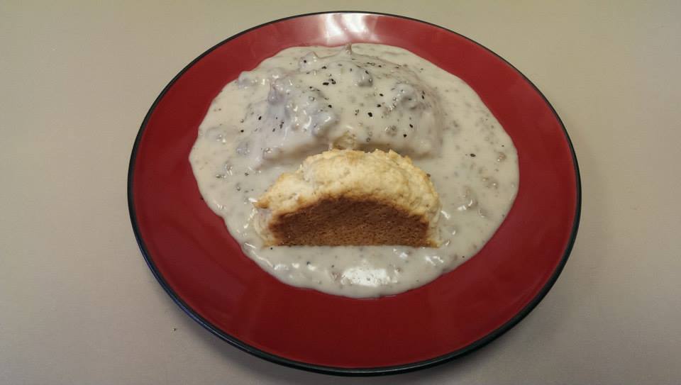 biscuits and gravy on a red plate