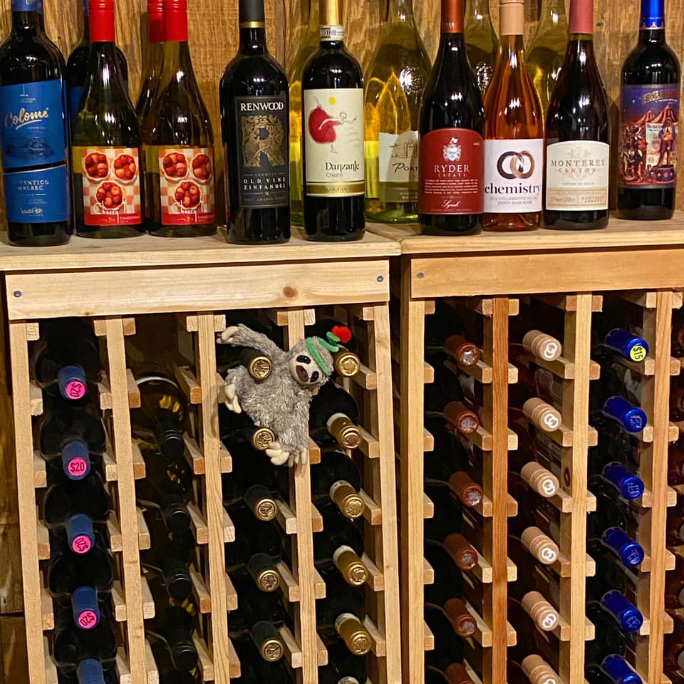 wine storage rack with wine bottles displayed on top