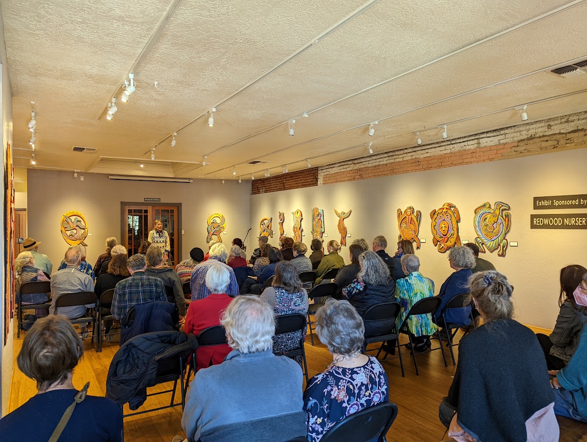 Attendees enjoying the artists's lecture