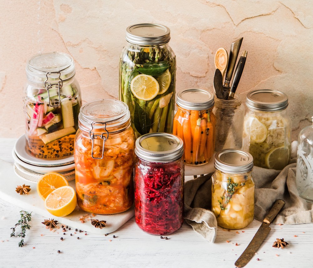 Pickled goods sitting on a table