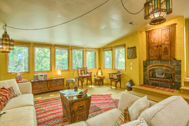 Inside view of common area with warm tones and fireplace