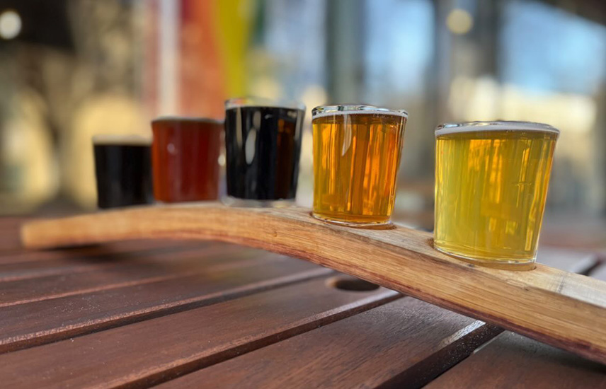 A rainbow array of beers on a tasting platter
