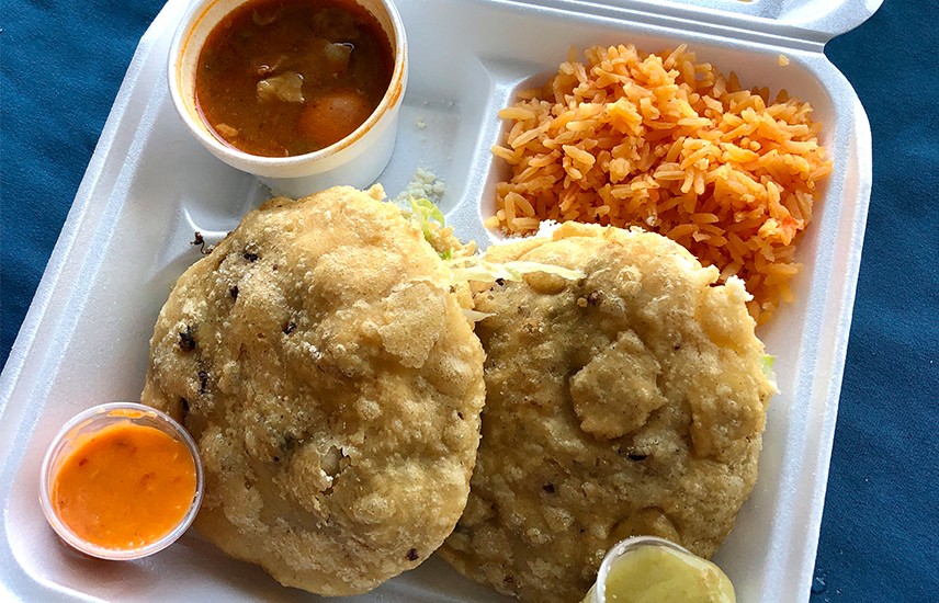 Gorditas, beans, Mexican rice and hot sauce