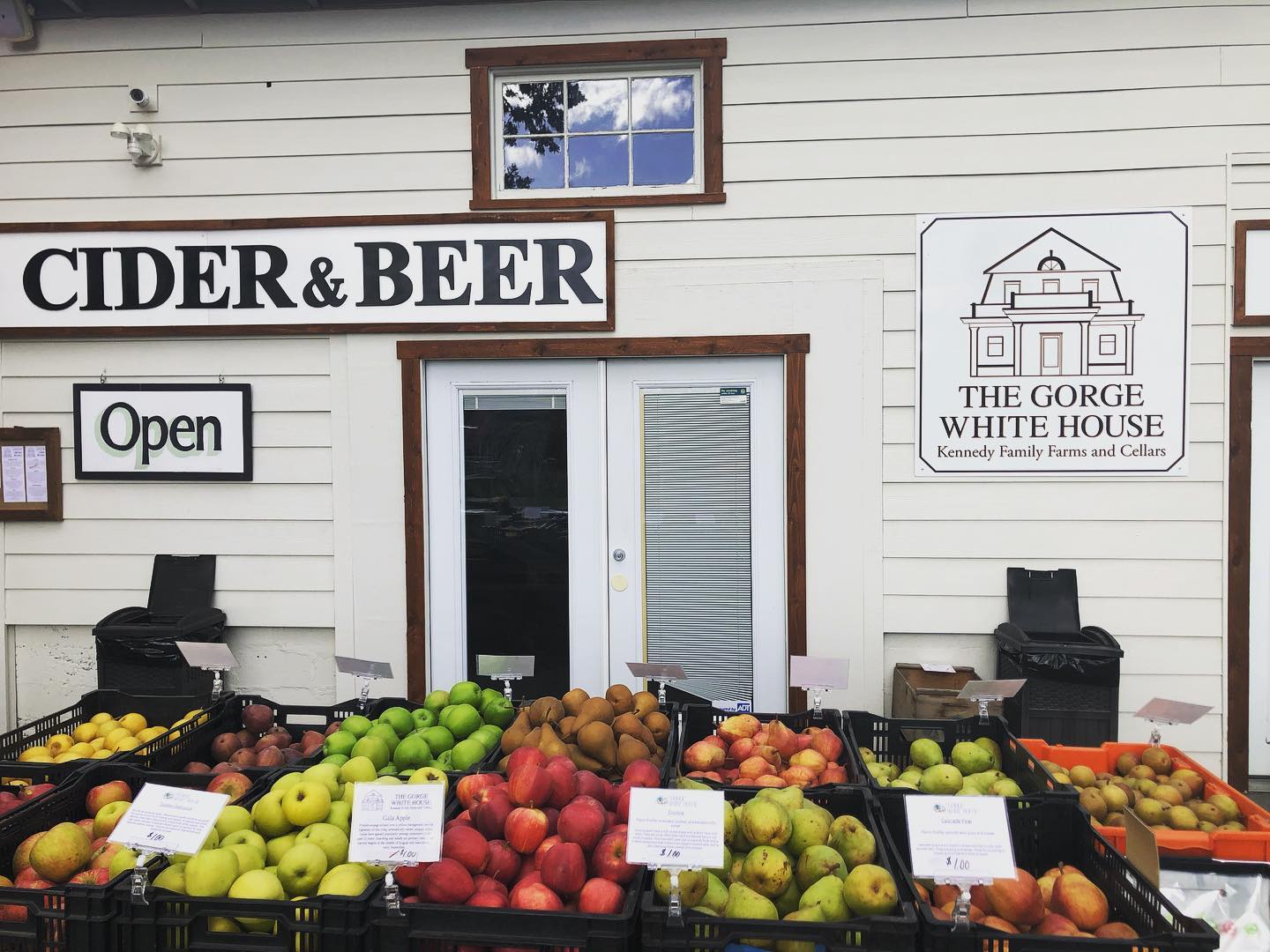 fruit stand outside of rustic tasting room