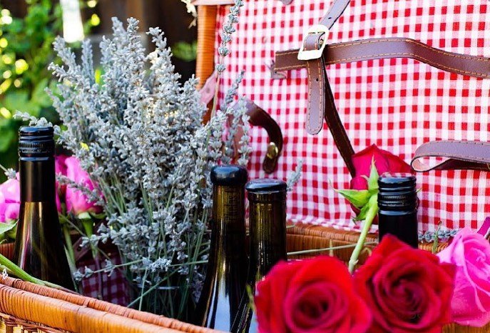 Basket of wine with flowers