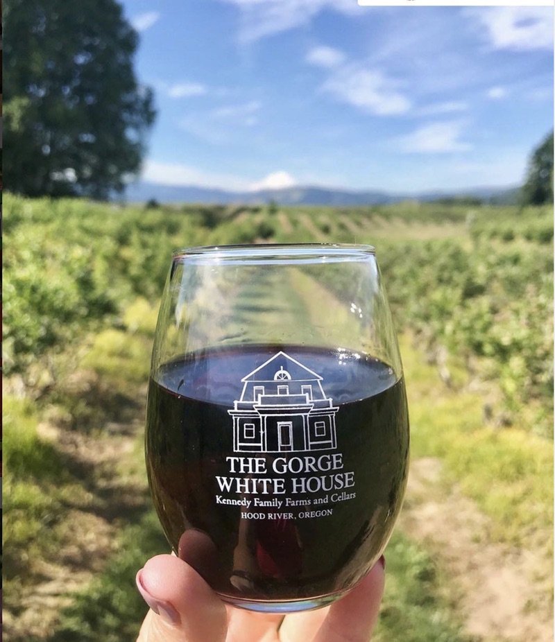 glass of red wine with lettering for The Gorge White House