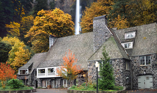 Stone historic Multnomah Falls Lodge with the waterfall behind it